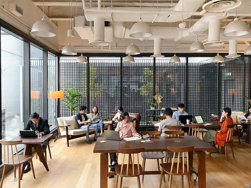 People working in a shared office space